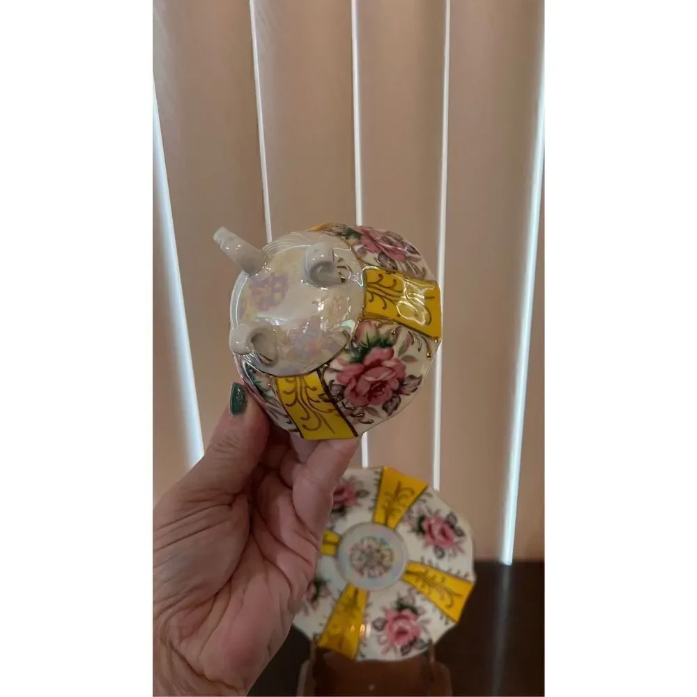 VINTAGE IRIDESCENT YELLOW TEA CUP AND SAUCER WITH ROSES